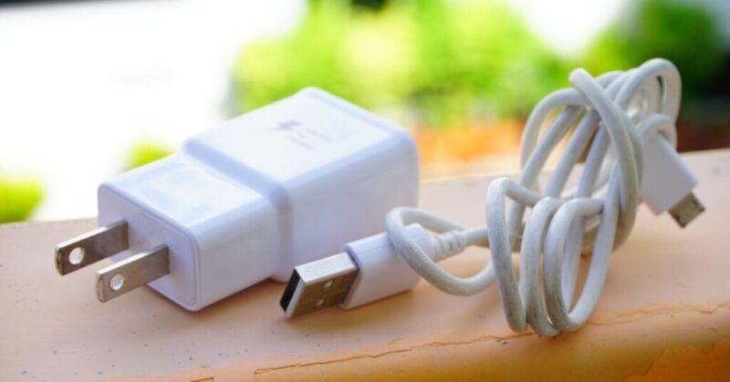Why it is not recommended to leave the charger plugged in without charging any device