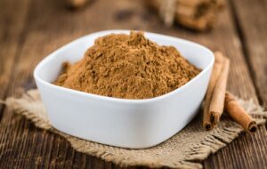 cinnamon,powder,as,high,detailed,close up,shot,on,a,vintage