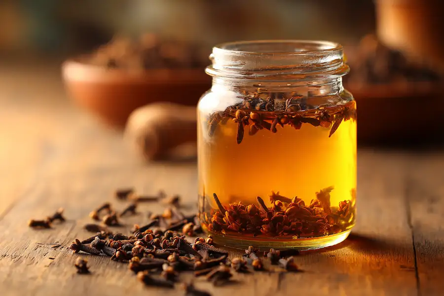 clove infused honey jar whole cloves natural remedy